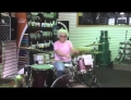 This Grandma really knows how to jam on the drum set