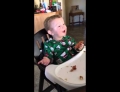 Baby tries bacon for the first time and he loves it.