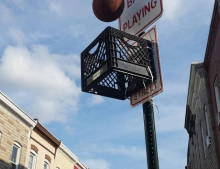 No ball playing sign makes a great backboard for a game of urban crate ball.