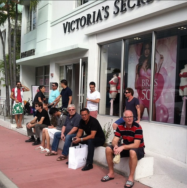 Guys waiting for their wives outside Victoria's Secret.