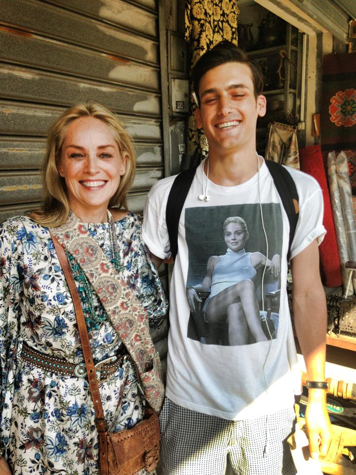 Sharon Stone spots a man in Tel Aviv wearing a Basic Instinct shirt and asks to take a picture with him.
