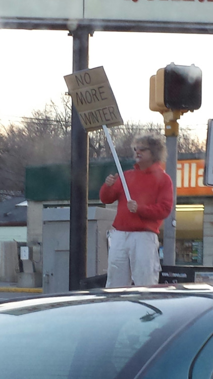 This guy hates winter so much he is protesting it.