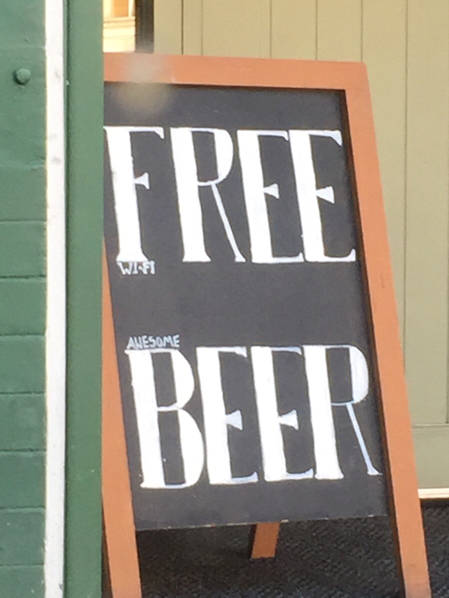 Clever sign to get people in the door offering free beer. Nobody reads the fine print these days.