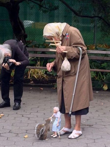 Elderly Woman Has Found A Fun And Unique Way To Feed The Squirrels.