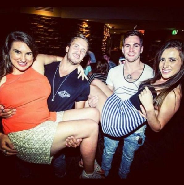 Everyone is smiling except the one guy who appears to be in pain.