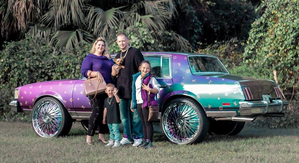 Did this family buy their clothes before or after painting their car?