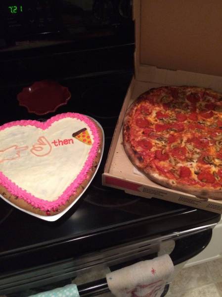 Heart shaped cake with a secret message and pizza. Romance in its finest form.