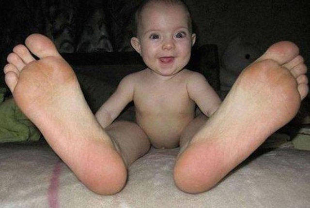 If this baby grows into his feet, he should be about 9 feet tall.