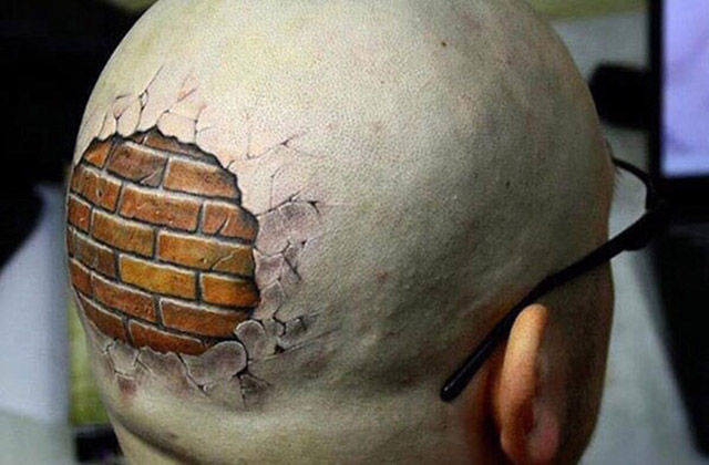 Killer head tattoo shows this mans brain is protected by a brick wall.