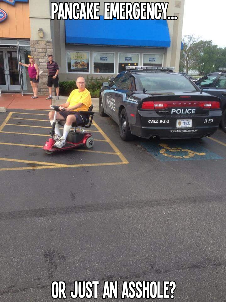 Man in mobility scooter finds a great photo op when a cop car parks in a handicap spot at an IHOP restaurant.