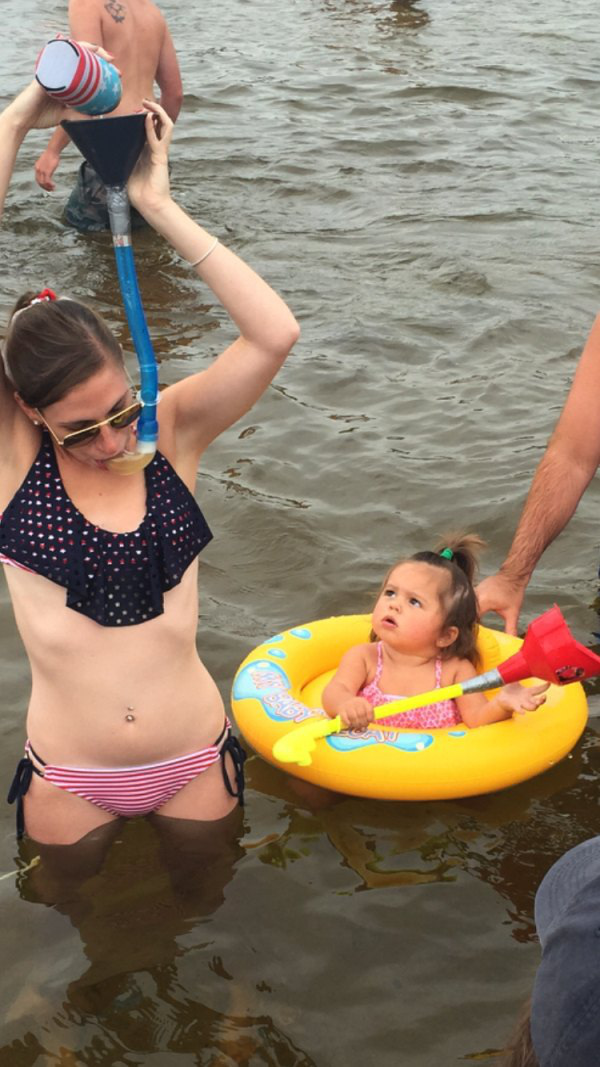 Mommy showing off her snorkel beer bong skills.