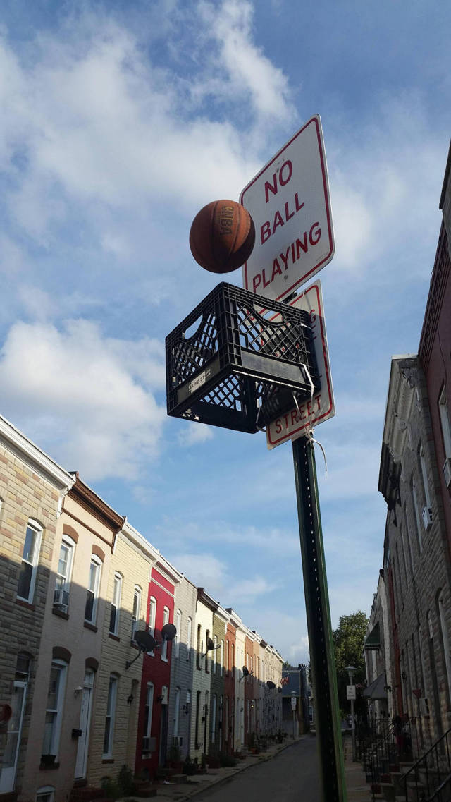No ball playing sign makes a great backboard for a game of urban crate ball.