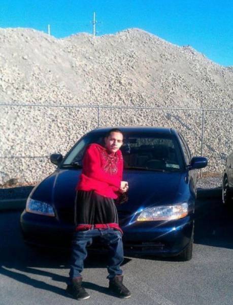 Nothing says cool like leaning up against your car with your pants down by your knees.
