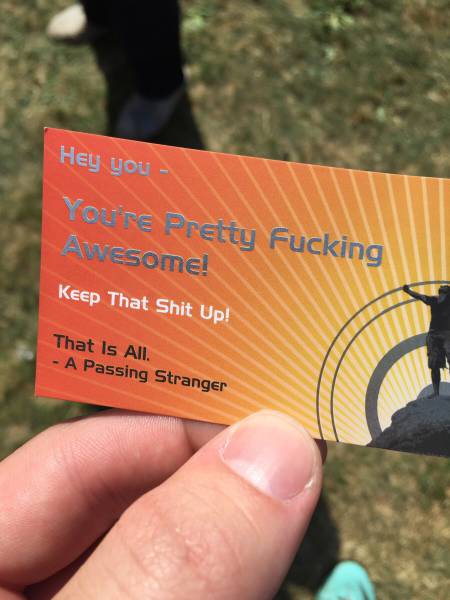 Passing stranger hands out business cards.