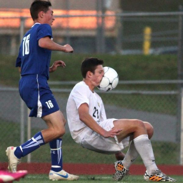 Soccer Player Gets A Face Full Of Ball In This Perfectly Timed Picture.
