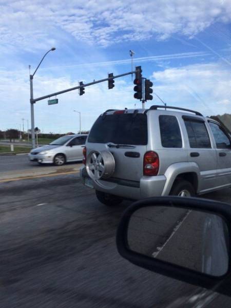 Someone jacked this guys spare tire. Not the entire wheel, just the tire.