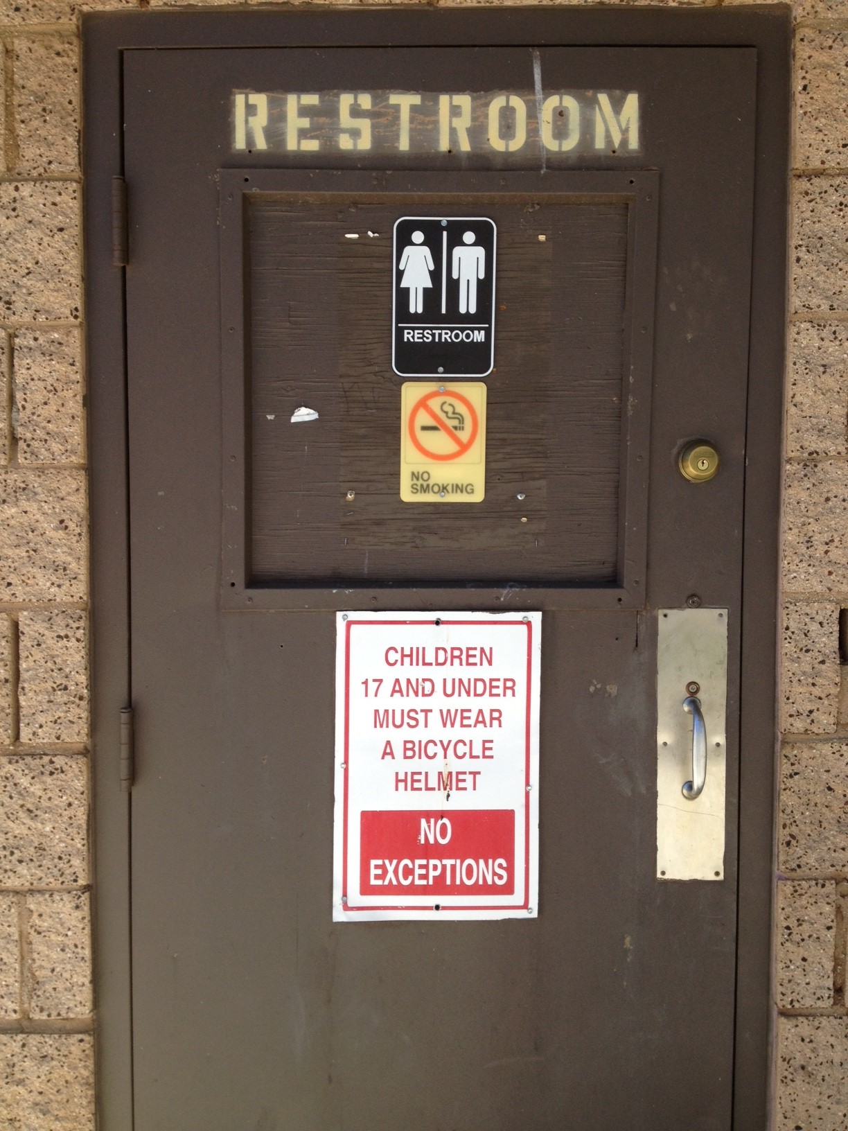 Strange bathroom requires kids 17 and under to wear a helmet.