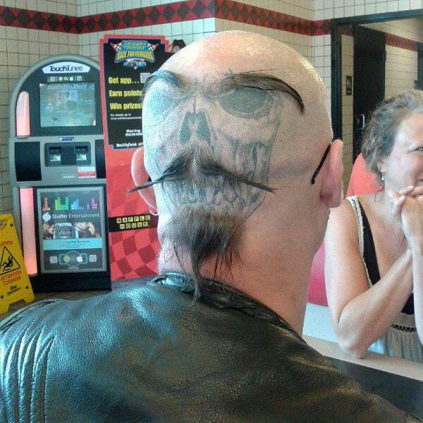 This Guy Adds An Extra Sense Of Style To His Back Of The Head Tattoo.