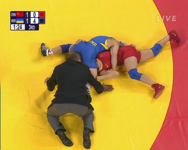 Wrestling Referee Really Likes To Get Up Close And Personal In The Action.