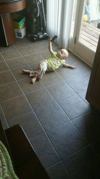 Baby posing for a selfie is cute and disturbing at the same time.