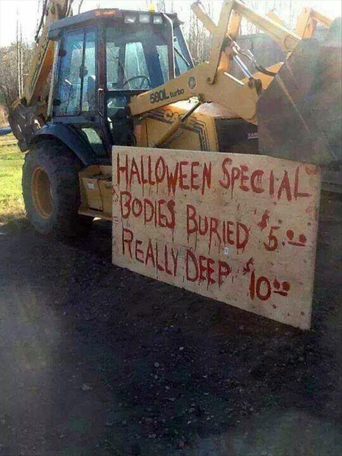 Backhoe operator has a Halloween special.