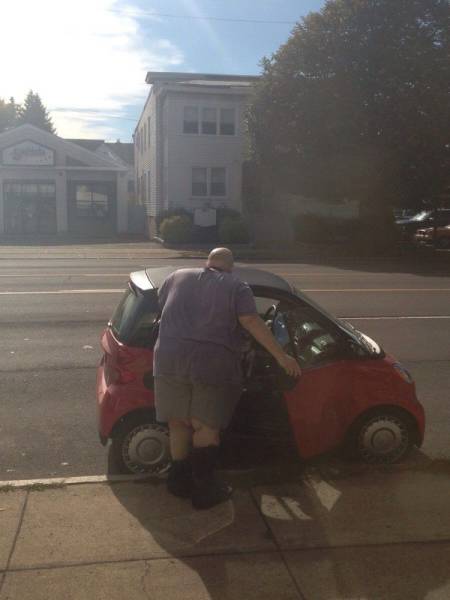 Fat guy and a Smartcar. This could get interesting.