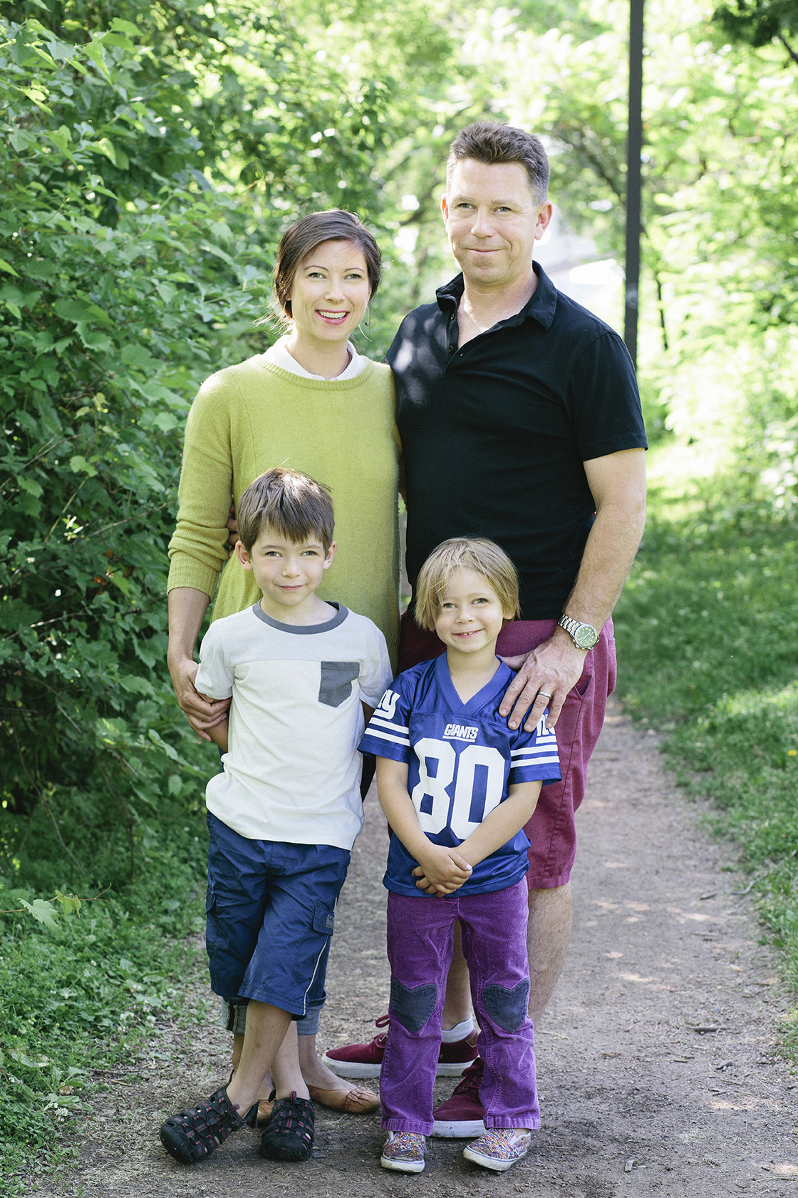 Guy has a lazy eye and forgot his glasses for family pictures so his brother fixed it for him.
