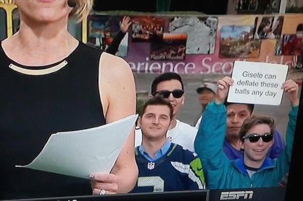 Man holds up sign during live ESPN sportscast with an offer for Tom Brady's beautiful wife Gisele Bündchen.