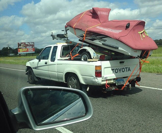 Proud new owner of a personal watercraft with trailer.