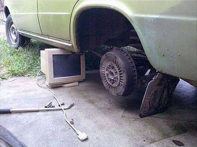 Old outdated computer monitors work great as a redneck jackstand.