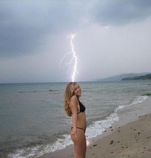 Beach hottie in bikini gets nailed by lightning strike.