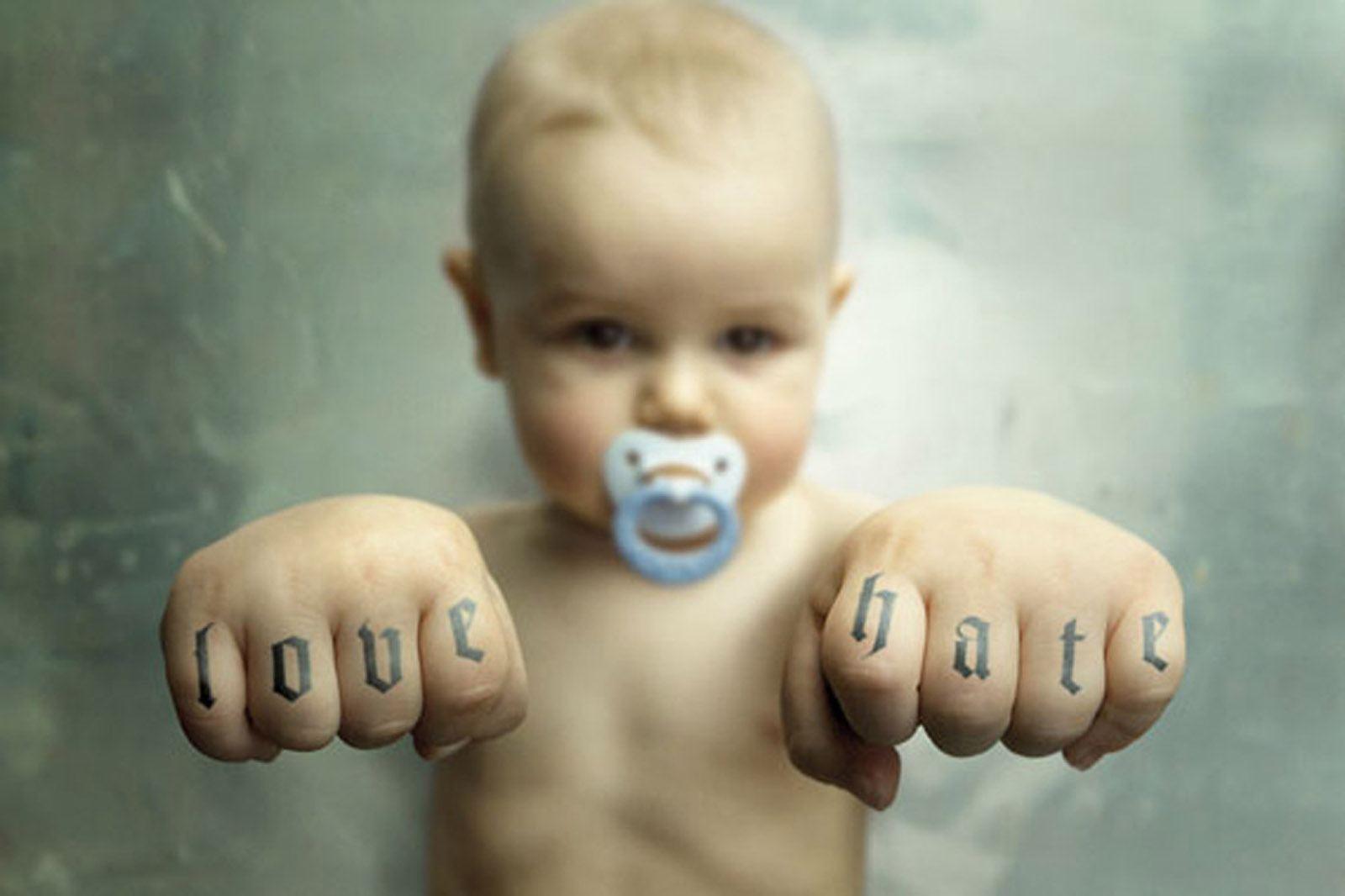 It is a good idea to teach your child the difference between love and hate but I don't think tattoos are such a good idea.