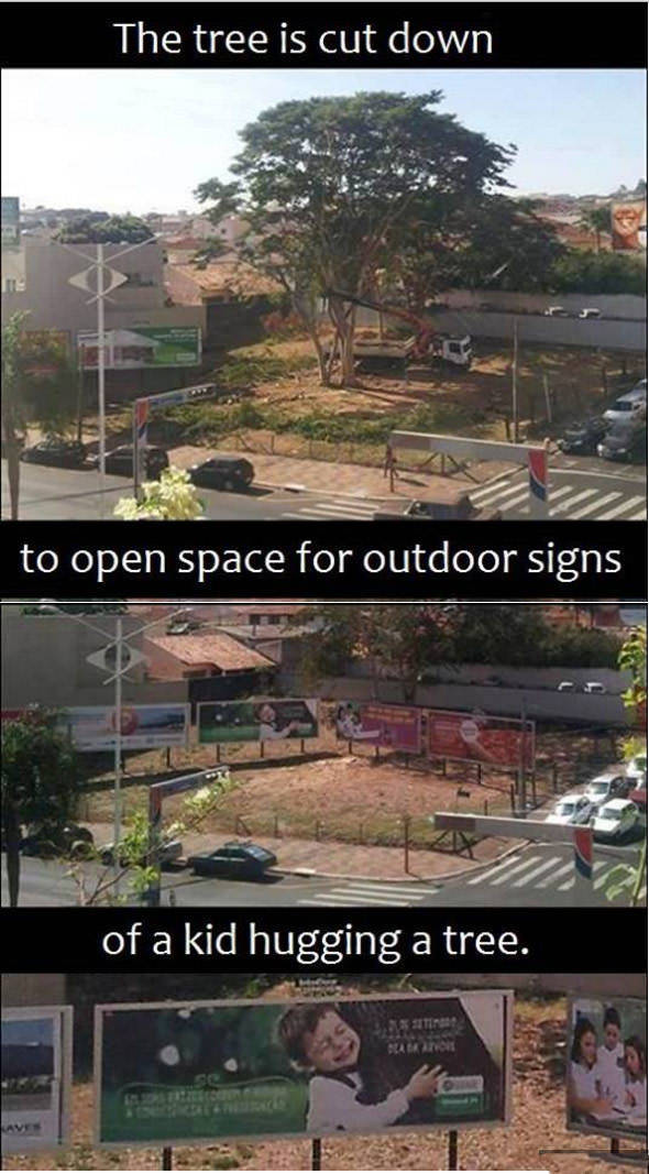 The tree is cut down to open space for outdoor signs.