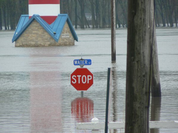 Water Is Paying No Attention To The Stop Sign On Water Street.
