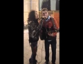 Steven Tyler of Aerosmith sings with a street musician in Moscow, Russia.