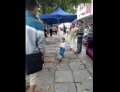 Toddler uses metal pipe to defend his grandma from China's urban management force.