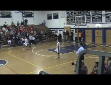 Twin brothers have identical reaction during basketball game.