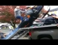 Dude attempting to load his brand new snowmobile in his truck fails hard.