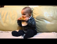 10 month old baby playing the harmonica like a pro.