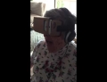 Grandma experiences a roller coaster simulation using Google Cardboard VR for the first time.