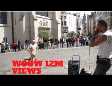 Grandma gets down while listening to a street performer.