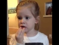 Little girl tries Warheads sour candy for the first time.