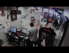 Robbers get locked inside cellphone store, crowd watches and laughs.