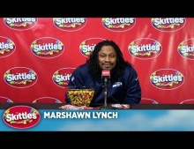Marshawn Lynch of the Seattle Seahawks finally answers questions during a press conference thanks to Skittles.