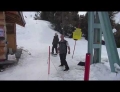 Snowboarder Attempts To Get A Ride Up The Mountain On Drag Lift For The First Time.