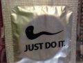 Condom with the familiar slogan of 'Just Do it' and splooge logo is a nice touch.