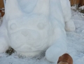 Doggy snow sculpture looks exactly like the real thing.