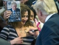 Donald Trump signing some boob.