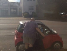 Fat guy and a Smartcar. This could get interesting.