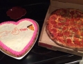 Heart shaped cake with a secret message and pizza. Romance in its finest form.